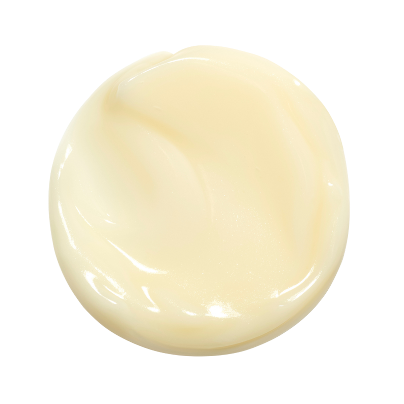 A circular blob of pale yellow cream